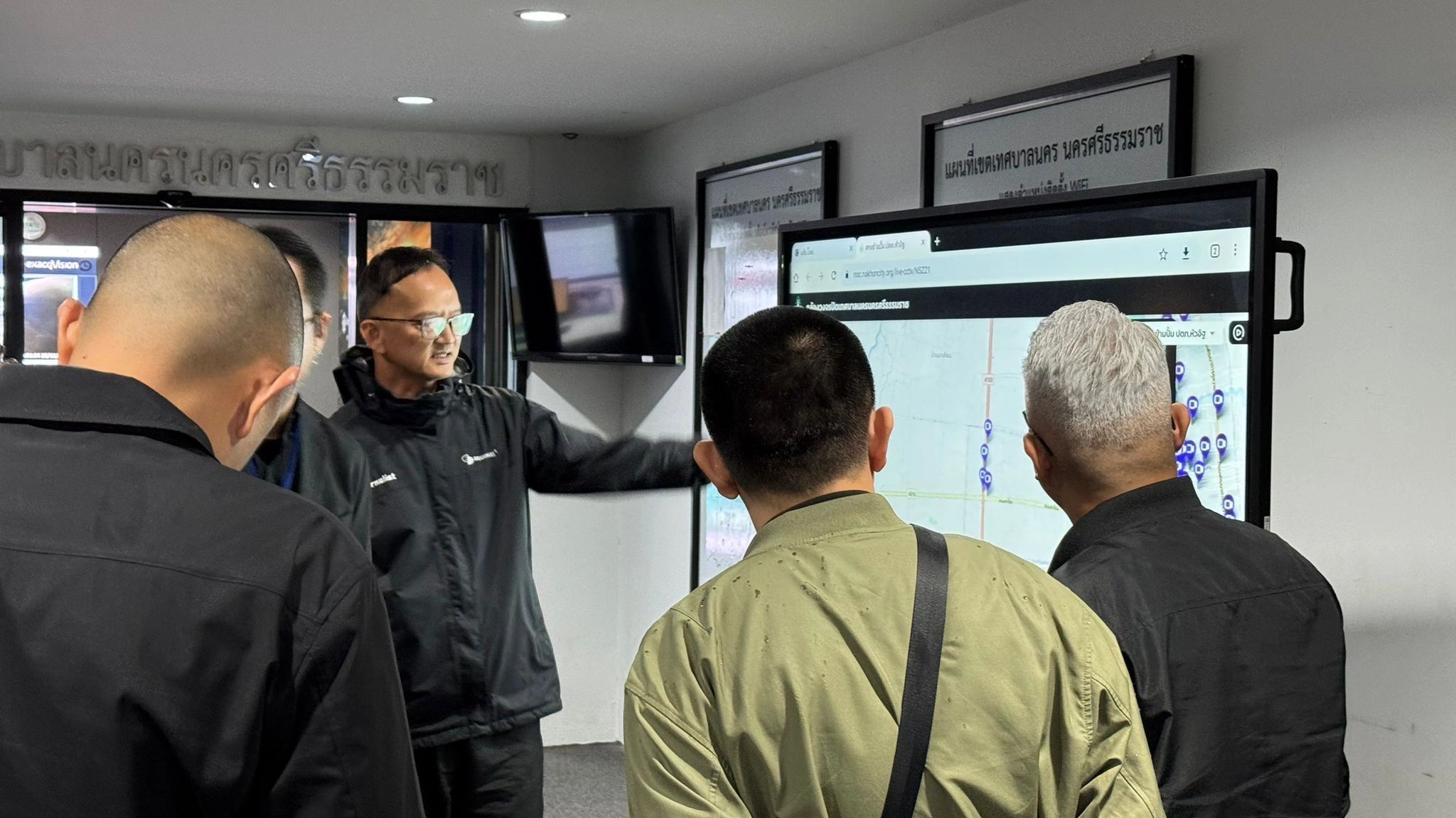 Workshop participants examining the city monitoring dashboard